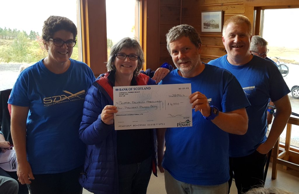 Julie Kirk of GreenPower presents £4,000 cheque to Colin Houston, Chair of the SDA.