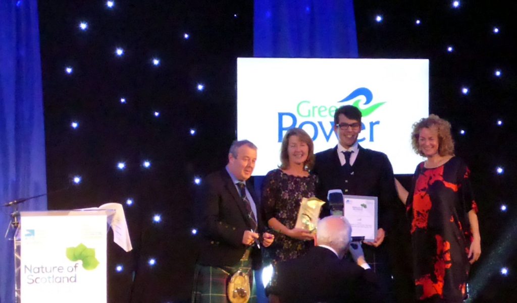 Findley Forrest, Project Manager of GreenPower presents 2018 Community Initiative Award to Ninewells Community Garden
